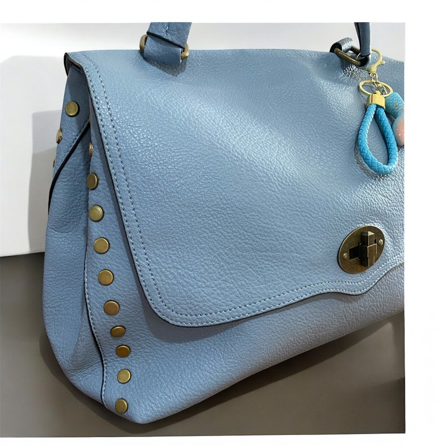 Borsa “La ondulata borchiata” - manico e tracolla