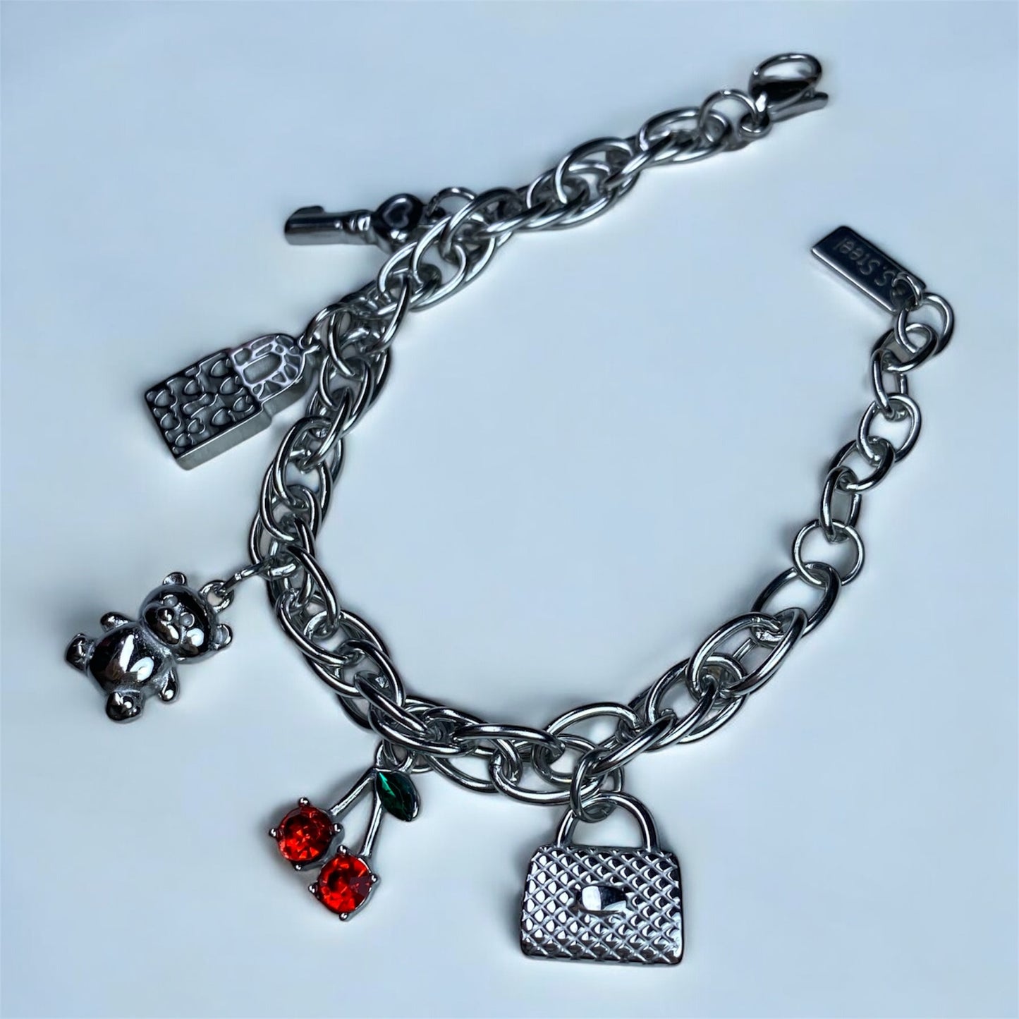 Bracciale con charm in acciaio-cilegia-orsetto