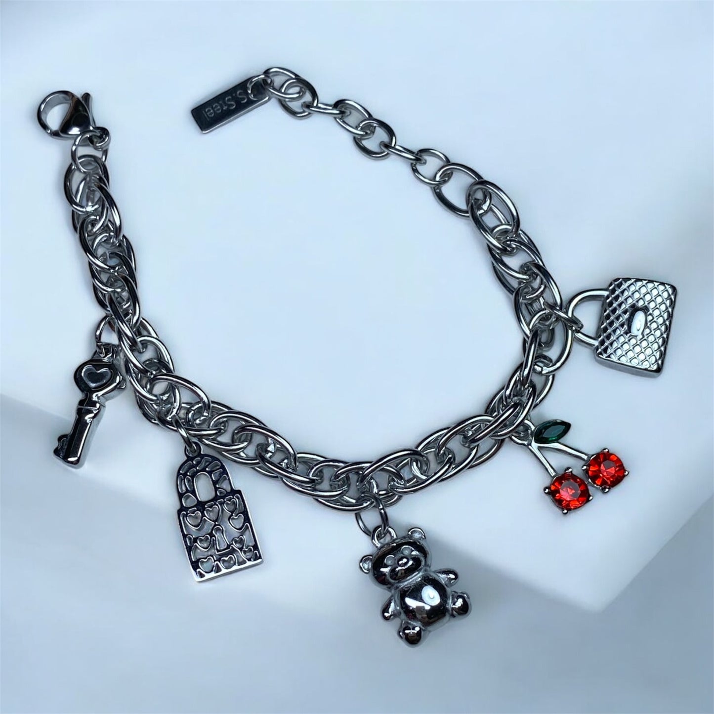 Bracciale con charm in acciaio-cilegia-orsetto