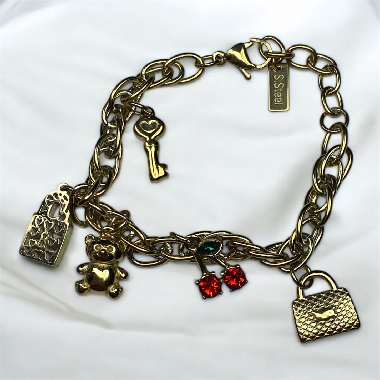 Bracciale con charm in acciaio-cilegia-orsetto