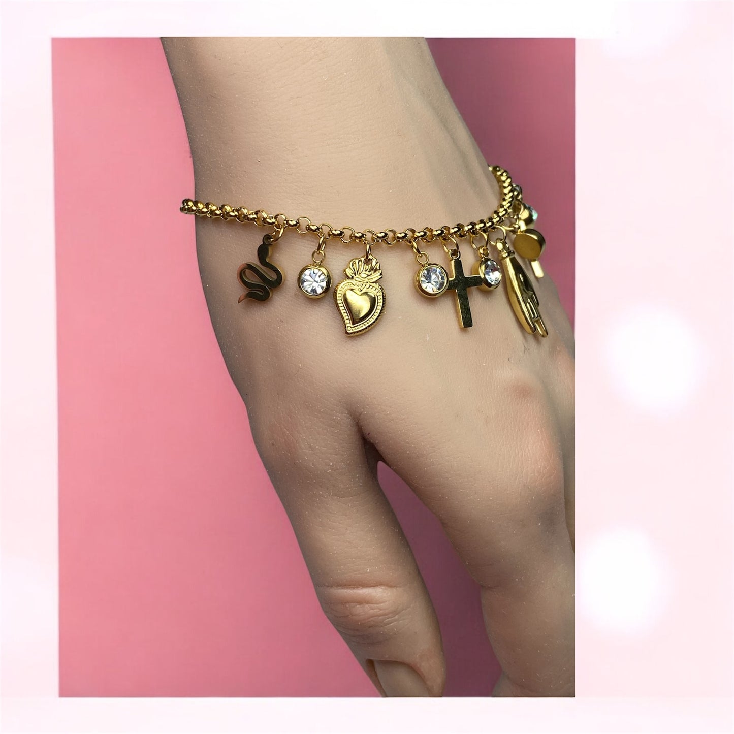 Bracciale con charm in acciaio- cuore-croce-corna-serpente-zirconi