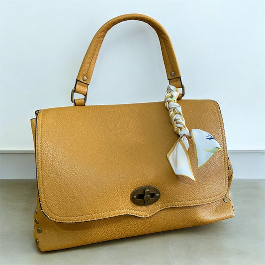Borsa “La ondulata borchiata” - manico e tracolla