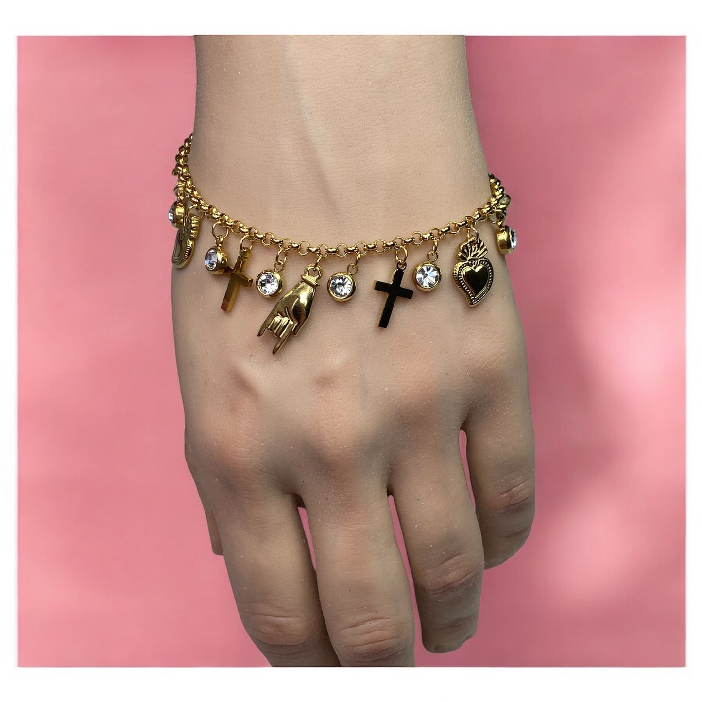 Bracciale con charm in acciaio- cuore-croce-corna-serpente-zirconi