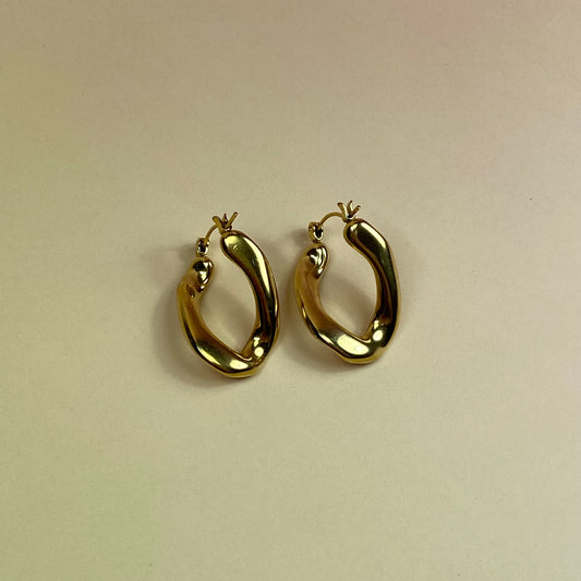 Orecchino girato gold - acciaio jewels